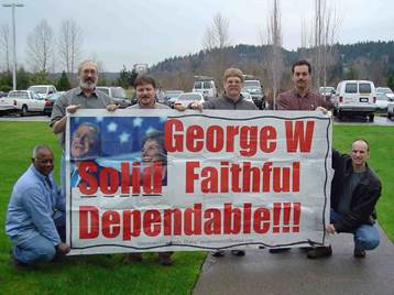 A group of men holding a sign

Description automatically generated